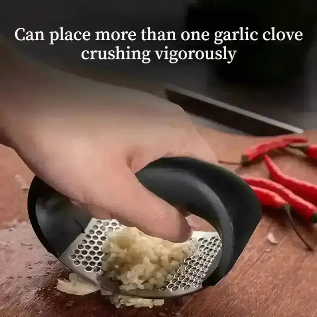 Stainless Steel Garlic Press - Garlic Crusher crushing several cloves at once.